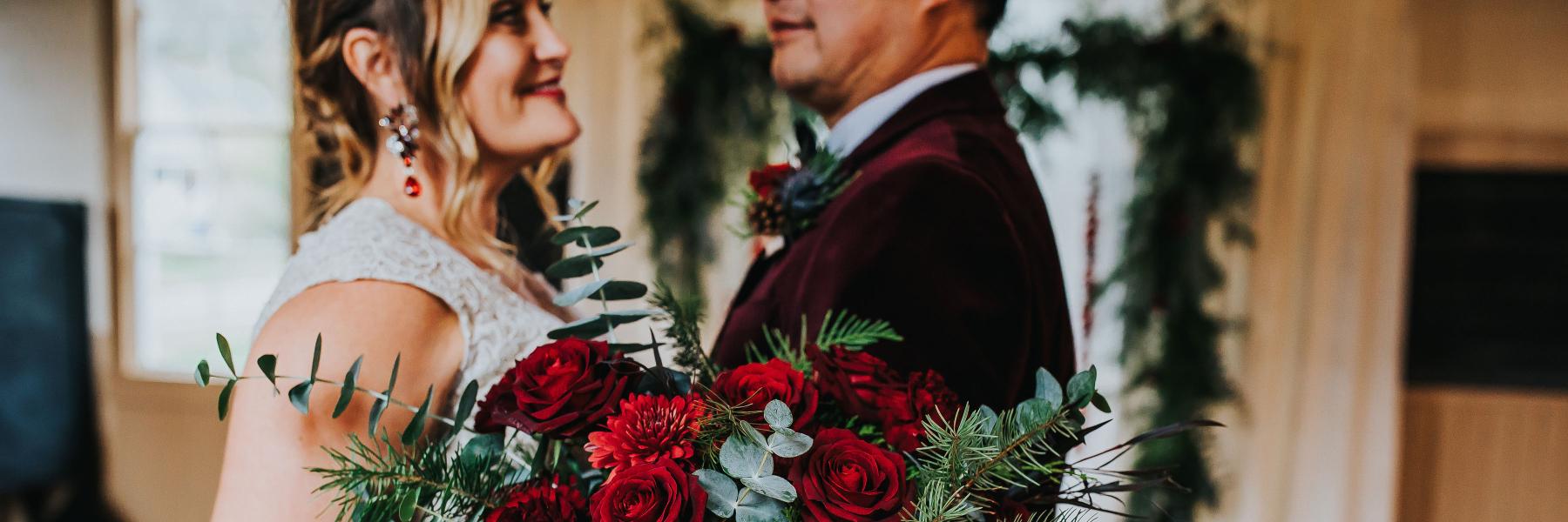 bride and groom with winter bridal bouquet