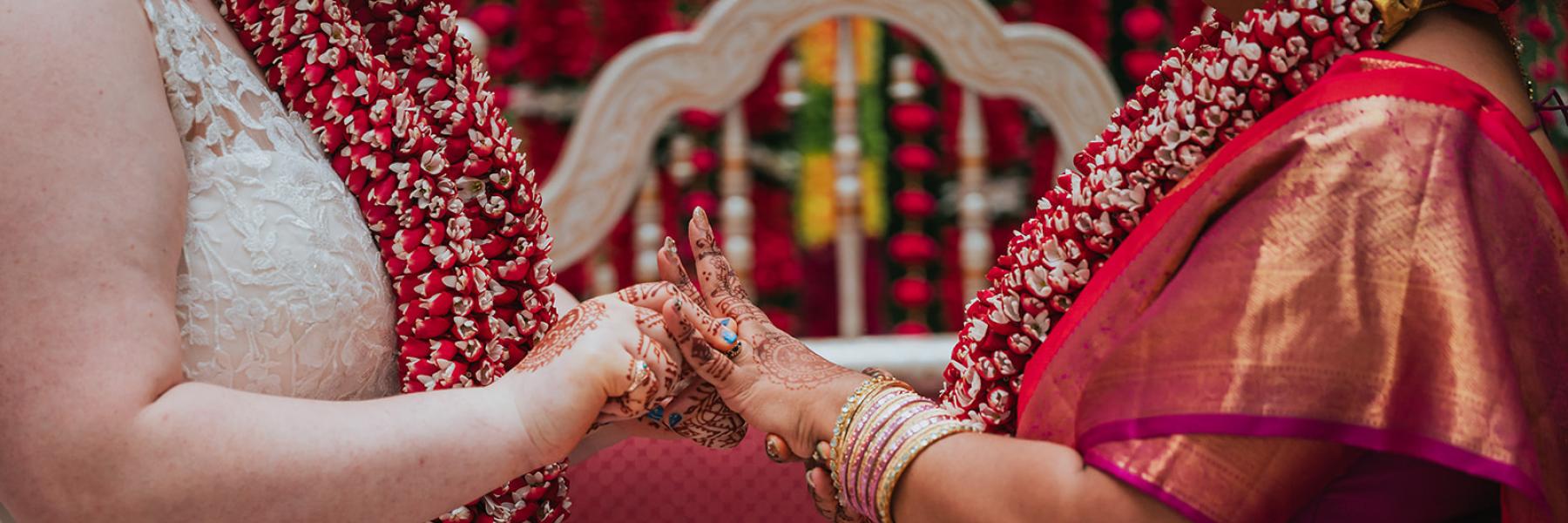 image of two brides holding hands