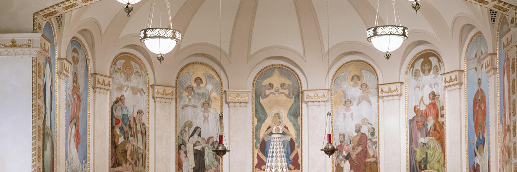 bride and groom kiss at altar