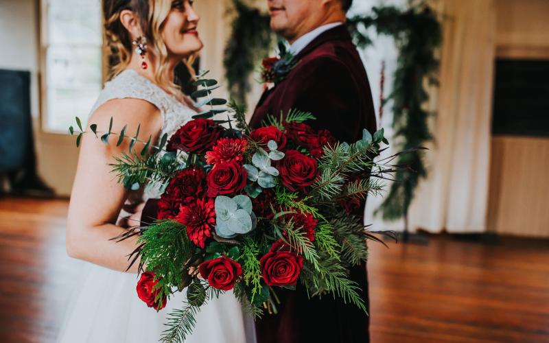 bride and groom with winter bridal bouquet