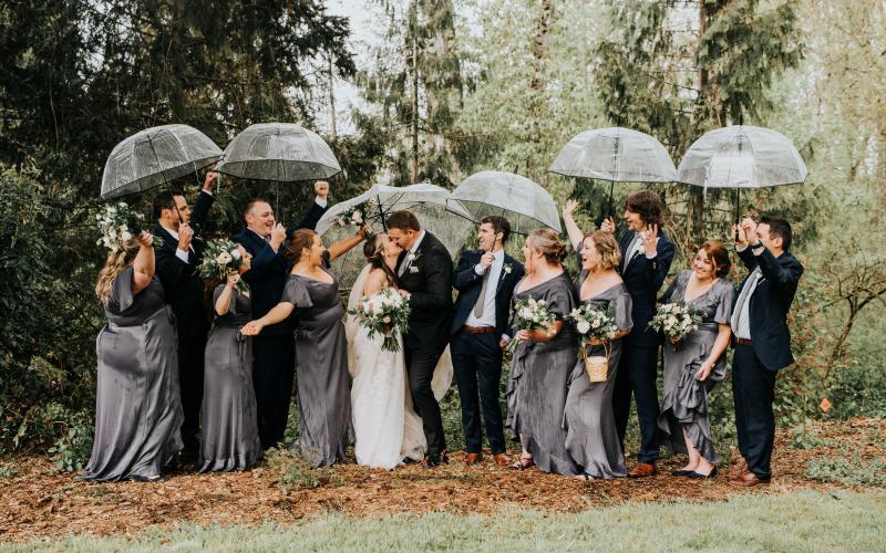 wedding party with umbrellas