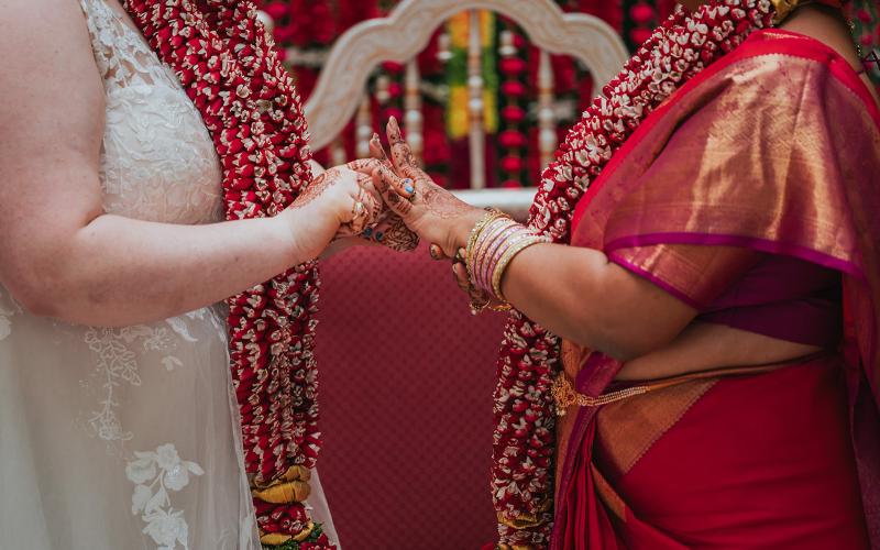image of two brides holding hands