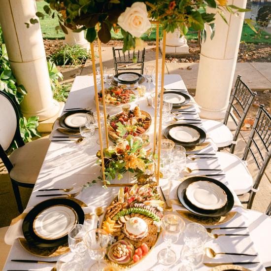 Elevated Centerpiece and Low Cluster of Blooms and Foliage