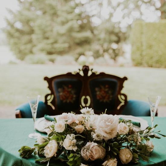 Low-wide arrangement on sweetheart table