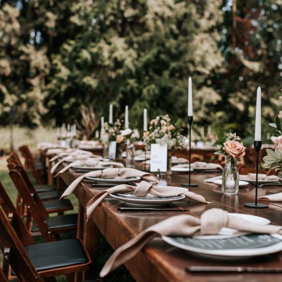 bud vases lining a dining table