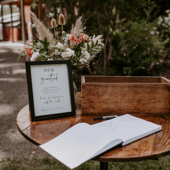 Guest book table with flowers