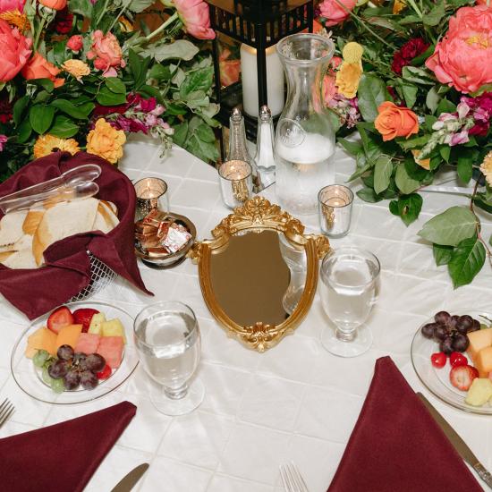 table with flowers and mirror