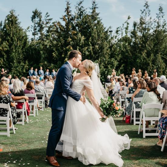 aubrey & adam kissing at end of aisle