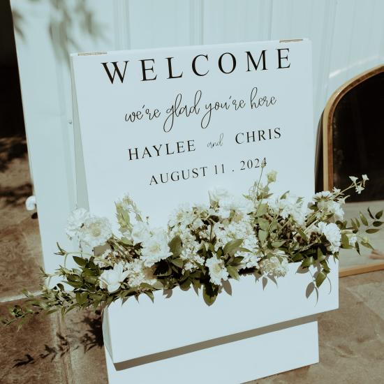 welcome sign planter box with flowers