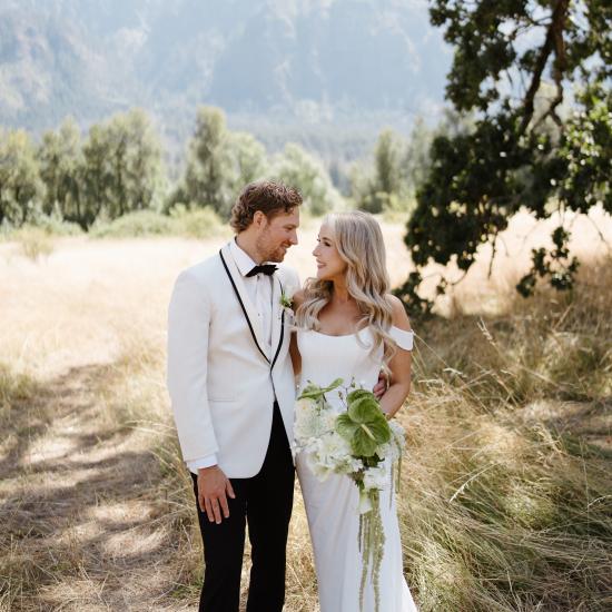 Alexa and Ryan standing in field