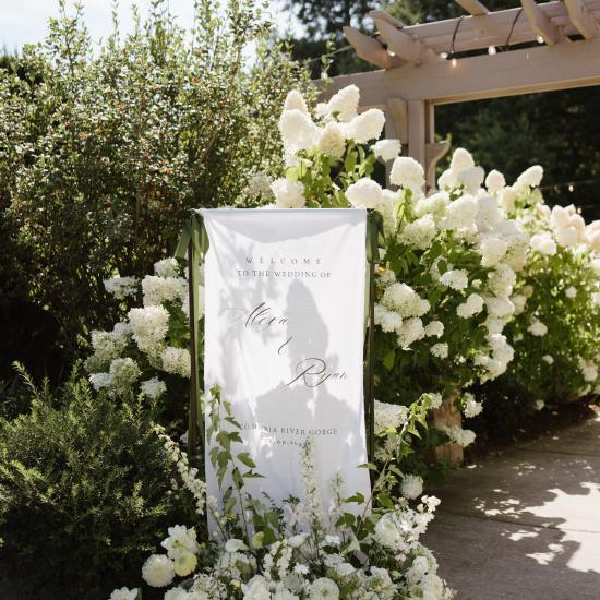 Meadow arrangement in front of welcome sign