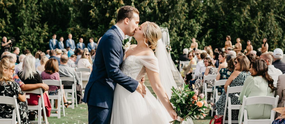 aubrey & adam kissing at end of aisle